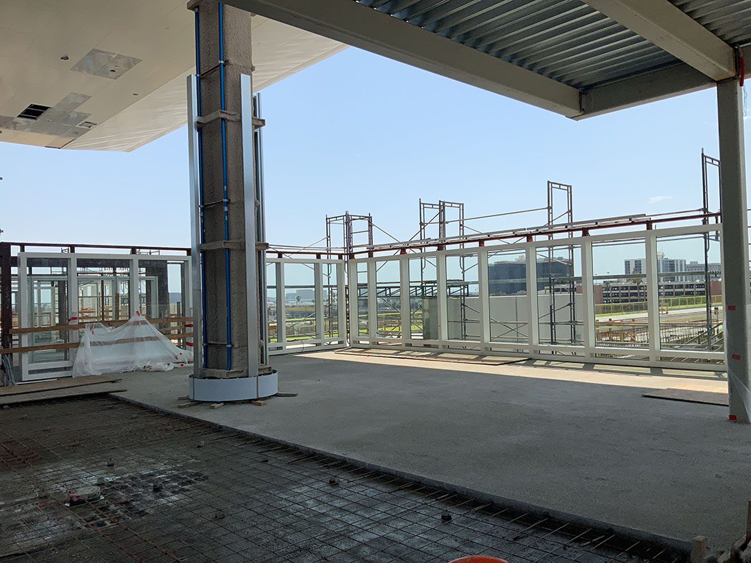 Installation of a barrier wall north of the Automated People Mover guideways