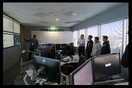 Image of students taking a tour of the hacking prevantion room mentioned in article.