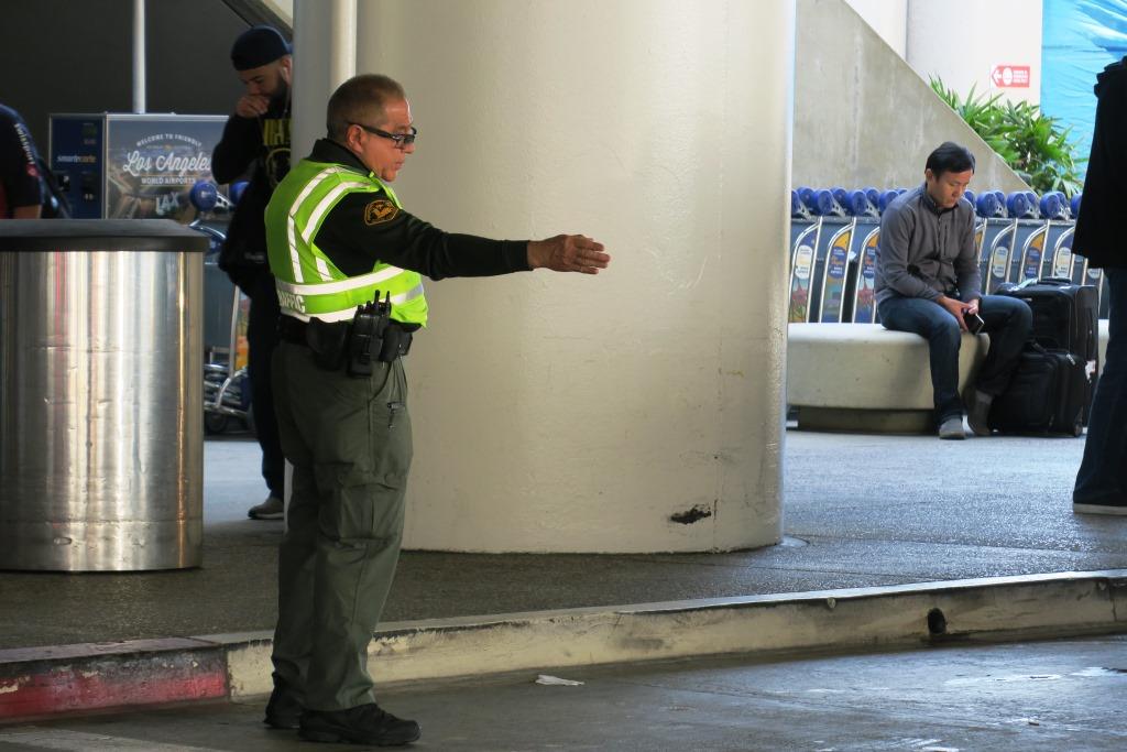 Police giving traffic sign