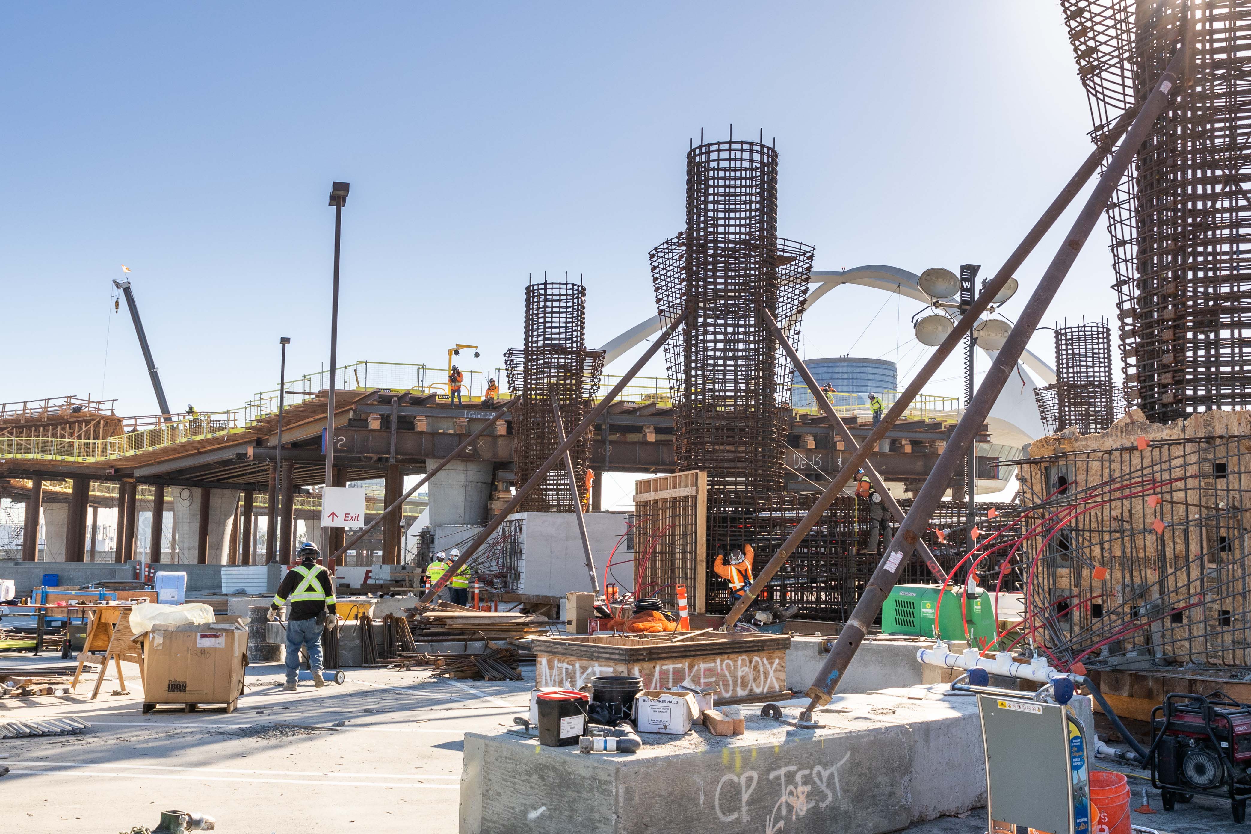 At the future Center Central Terminal Area station, work continues on the station's upper columns as guideway formwork construction approaches the station.